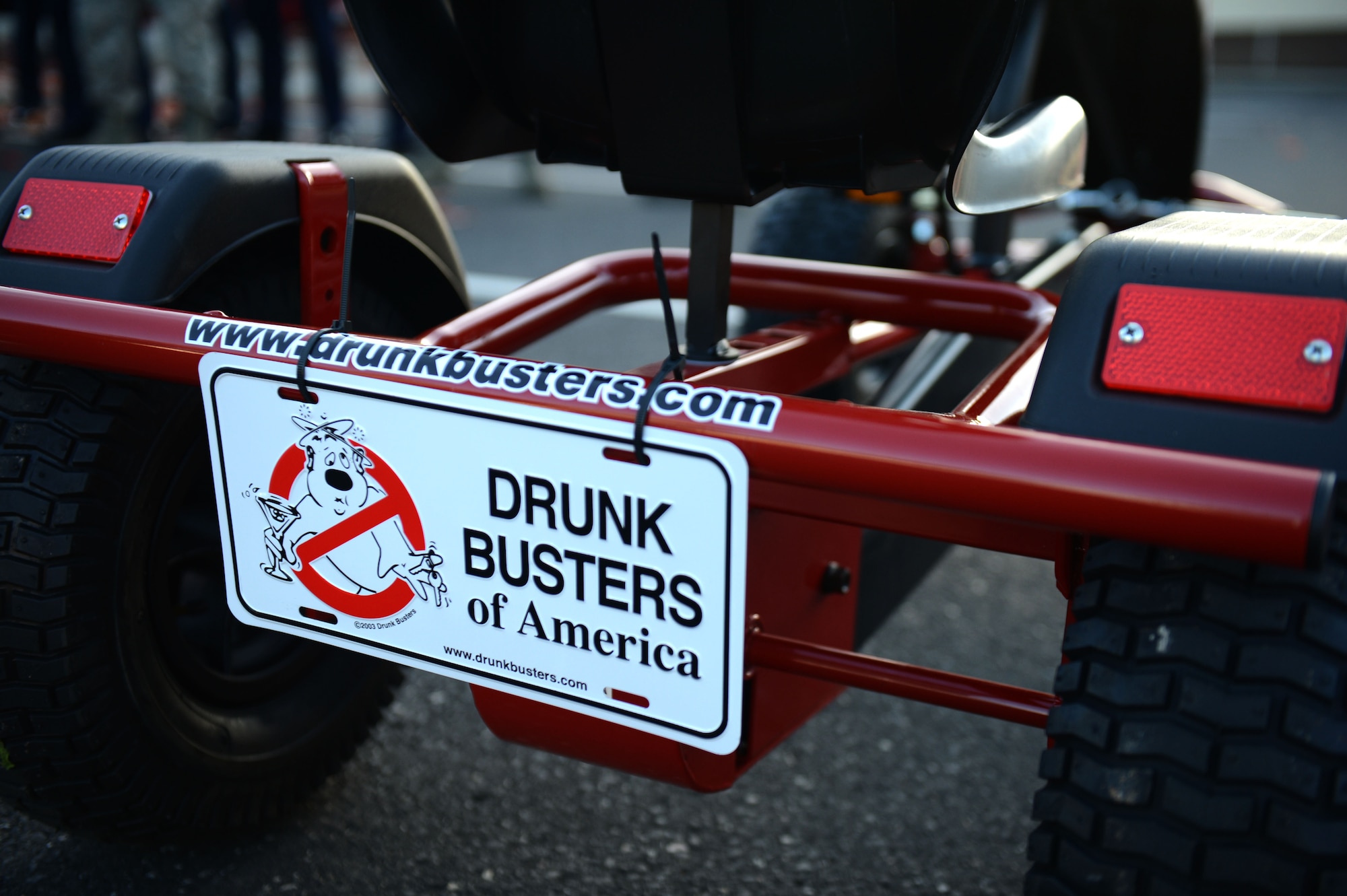 SPANGDAHLEM AIR BASE, Germany – A sign hangs from the back of a peddle go-kart outside the Spangdahlem Skyline Movie Theater during a “Drunk Busters” obstacle course event Oct. 22, 2012.  The purpose of the event was to raise awareness of the effects of alcohol to prevent alcohol-related incidents including driving under the influence. (U.S. Air Force photo by Airman 1st Class Gustavo Castillo/Released)