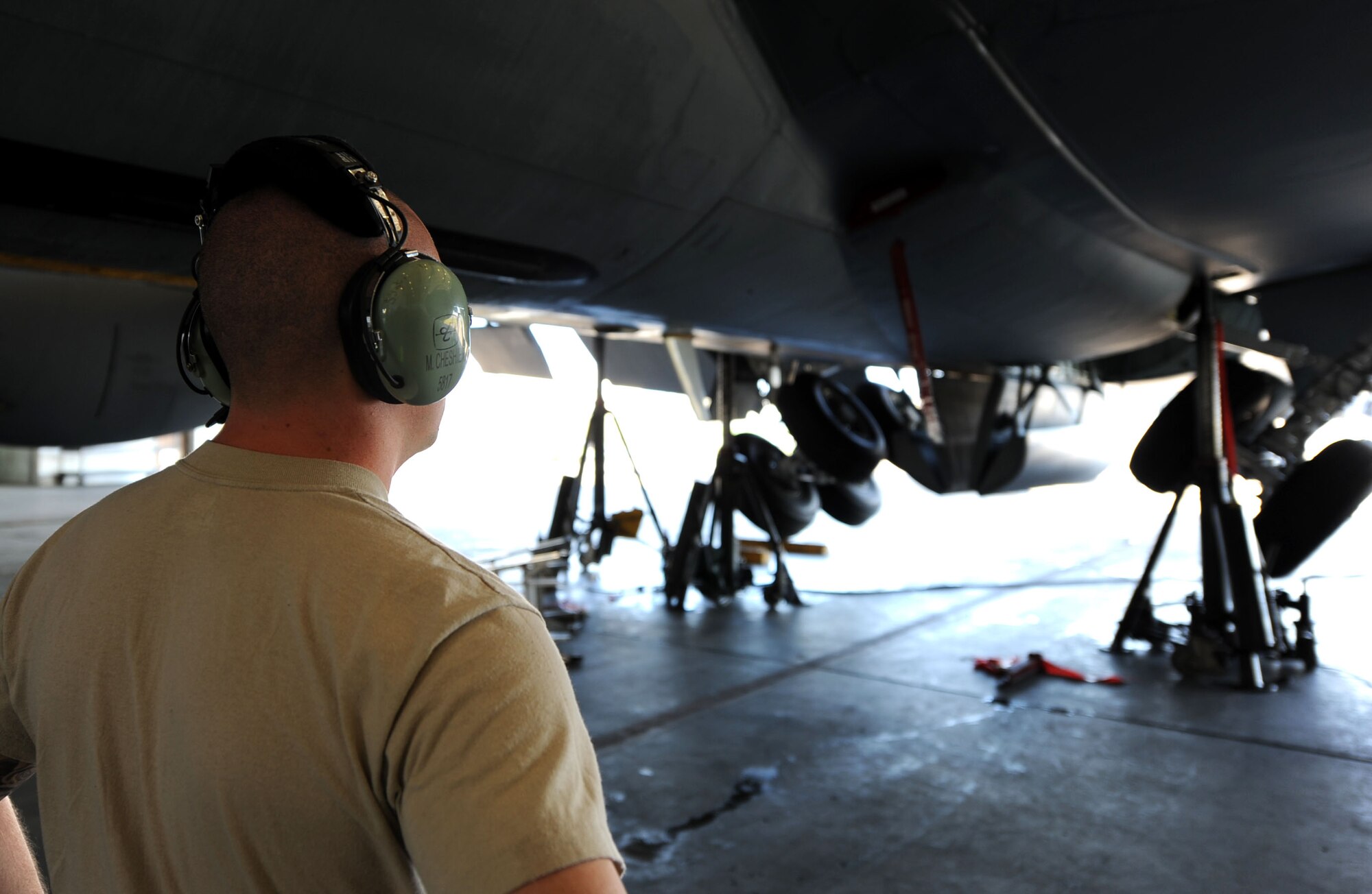 U.S. Air Force Staff Sgt. Martin Cheshier, 718th Air Maintenance Squadron electrical and environmental systems technician, observes the landing gear of a U.S. Air Force KC-135 Stratotanker refueling aircraft for routine maintenance during Exercise Beverly Bearcat - a Pacific Air Forces readiness inspection on Kadena Air Base, Oct. 23, 2012. The 718th AMXS maintains the Air Force’s only air refueling, combat search and rescue, and air battle management assets in the Western Pacific region. (U.S. Air Force photo/Airman 1st Class Brooke P. Beers)