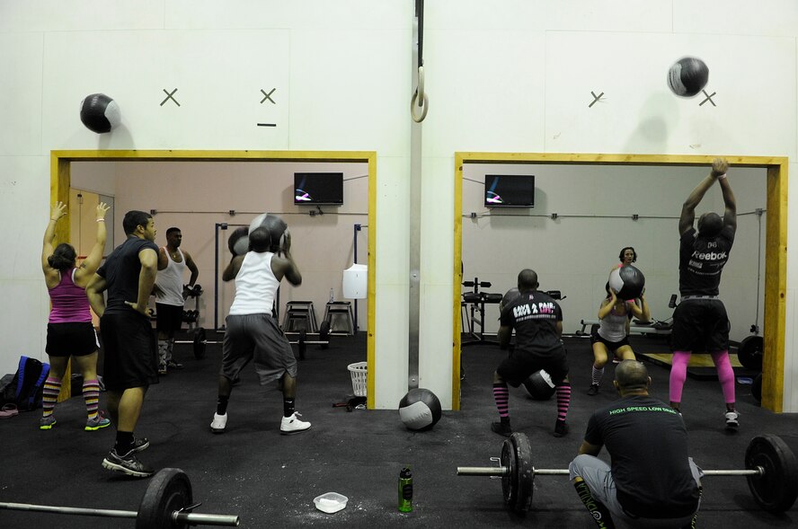 More than 20 CrossFitters showed up for a workout dedicated to breast cancer awareness Oct. 20, 2012, at Kunsan Air Base, Republic of Korea. Called “Grace meets Kelly,” the workout was 150 wall balls followed by 30 clean and jerks. (U.S. Air Force photo/Senior Airman Brigitte N. Brantley)