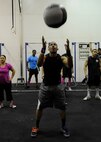 Senior Airman Jamal Nichols, 8th Maintenance Squadron, completes one of 150 wall balls during a breast cancer awareness CrossFit workout Oct. 20, 2012, at Kunsan Air Base, Republic of Korea. More than 20 CrossFitters showed up to sweat through their way through “Grace meets Kelly,” a workout of 150 wall balls followed by 30 clean jerks. (U.S. Air Force photo/Senior Airman Brigitte N. Brantley)