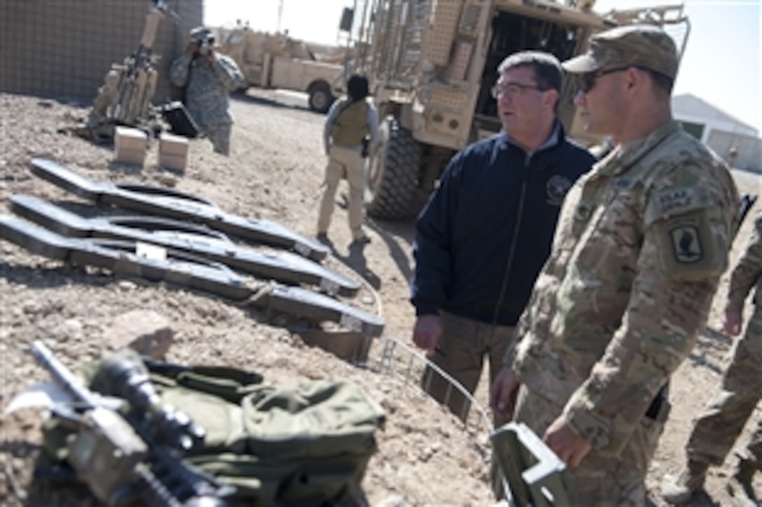U.S. Deputy Defense Secretary Ashton B. Carter visits with soldiers assigned to Combat Outpost McClain, Afghanistan, Oct. 22, 2012. 