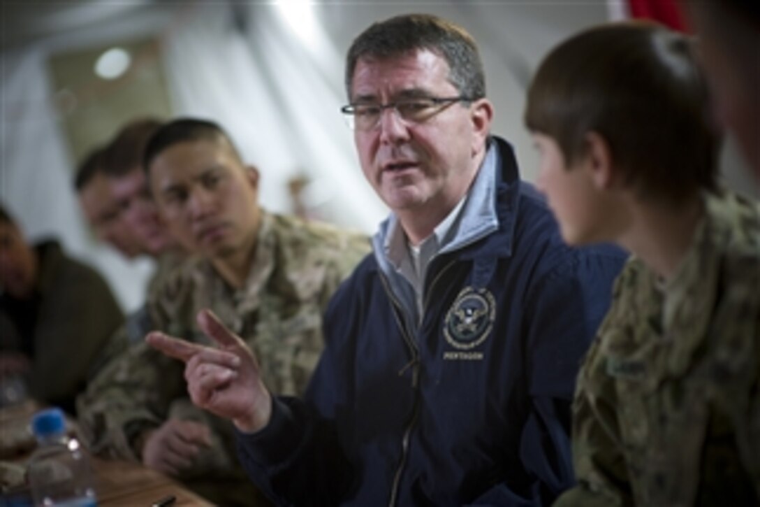 Deputy Secretary of Defense Ashton B. Carter dines with soldiers assigned to Combat Outpost McClain in Afghanistan on Oct. 22, 2012.  Carter is on a seven-day trip to the Middle East to meet with leaders and counterparts in the region.  