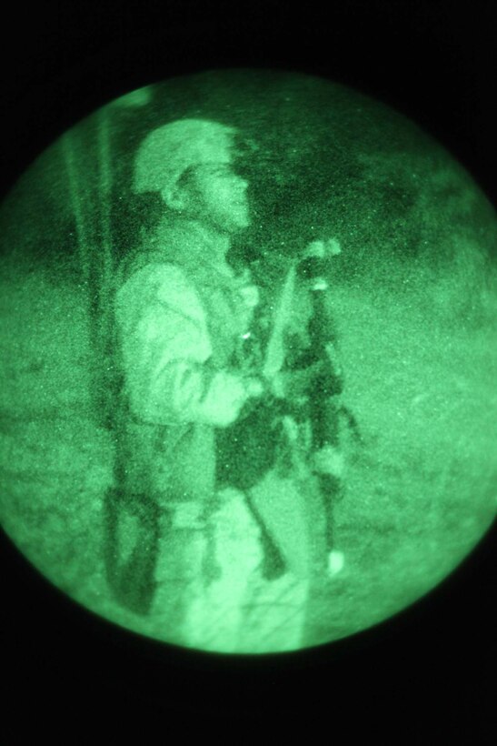 A squad leader with Combat Logistics Battalion 11, Combat Logistics Regiment 17, 1st Marine Logistics Group, stands guard during a night operation at Camp Pendleton, Calif., Oct. 18. During the Basic Combat Skills Course, instructors with the Combat Skills Training School offer classes and field operations to improve the combat readiness for multiple non-infantry units.




