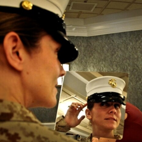 QUANTICO, Va. -A Marine checks out her cover in a mirror. Marine Corps Systems Command is conducting a survey to find out what female Marines think about new dress and service covers or caps. , MCB Quantico photo, 10/18/2012