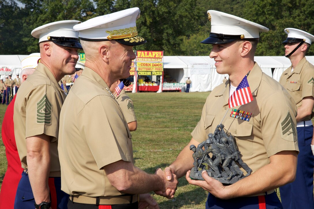 Sgt. Dante Capane receives the Reservist of the Year Award from Commandant of the Marine Corps, Gen. James F. Amos, and Sgt. Maj. of the Marine Corps, Michael P. Barrett, at Lejeune Field, Marine Corps Base Quantico, Sept. 26, 2012.  Of the 39,000 Reserve Marines, Capane was chosen to receive the award by the Marine Corps League.