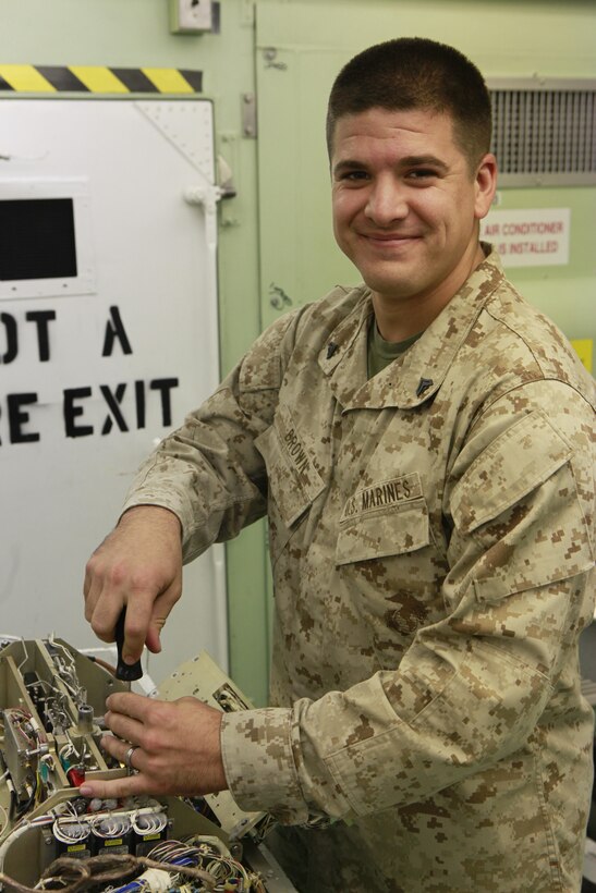 Cpl. Richard K. Brown, an electronic countermeasures technician with MALS-14, works on a weapons replaceable assembly at the MAG-14 NITE lab October 18, 2012. Finding the problem in a WRA, which contains more than 200 components, is what Brown says is the most difficult part of his job.