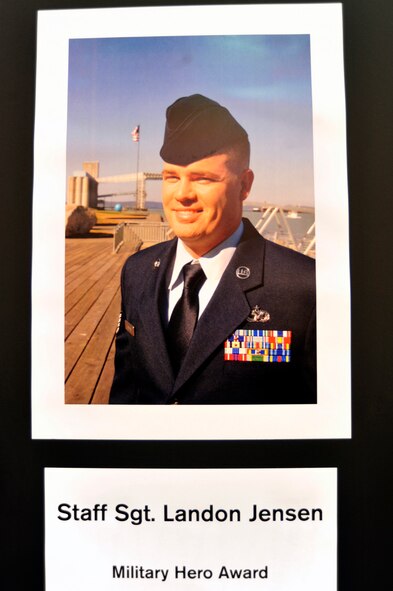 A picture of Staff Sgt. Landon Jensen, 62nd Aerial Port Squadron ramp services supervisor, is displayed Oct. 24, 2012, during the 2012 American Red Cross Pierce County Heroes Breakfast in Tacoma, Wash. Jensen, who's currently deployed, received the "Military Hero Award" for saving a woman from a burning car last year. (U.S. Air Force photo/Staff Sgt. Frances Kriss)