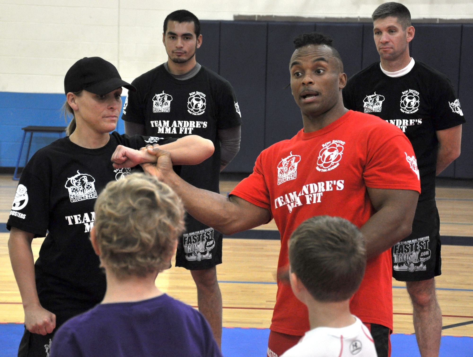 Mixed martial arts fighter Jermaine Andre demonstrates self-defense techniques Sunday at the James Sports Center at Scott Air Force Base. Andre conducted demonstrations about youth anti-bullying and women's self defense that covered bully awareness, abduction resistance, boxing, kick boxing, grappling and street defense. (U.S. Air Force photo/Airman 1st Class Josh Eikren)