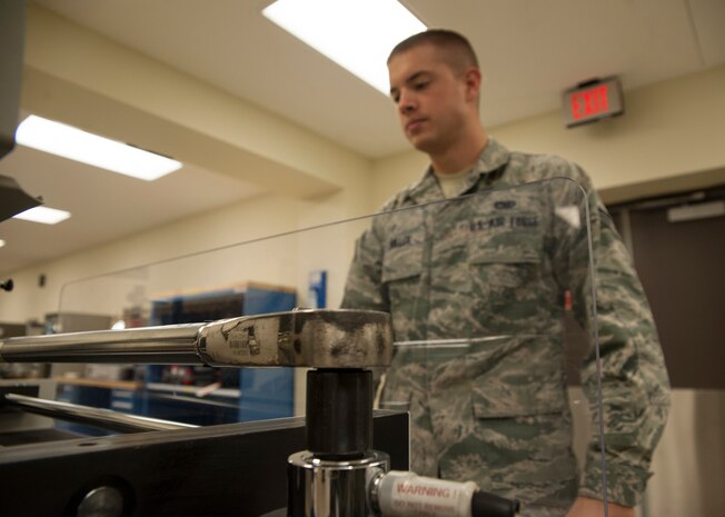Senior Airman Herschel Miller, 437th Maintenance Squadron Precision Measurement Equipment Laboratory Calibration technician, calibrates a torque wrench on a CDI torque calibrator Oct. 16, 2012 at Joint Base Charleston - Air Base, S.C. The CDI torque calibrator is used to show how accurate a torque wrench is. (U.S. Air Force/Airman 1st Class Ashlee Galloway)
