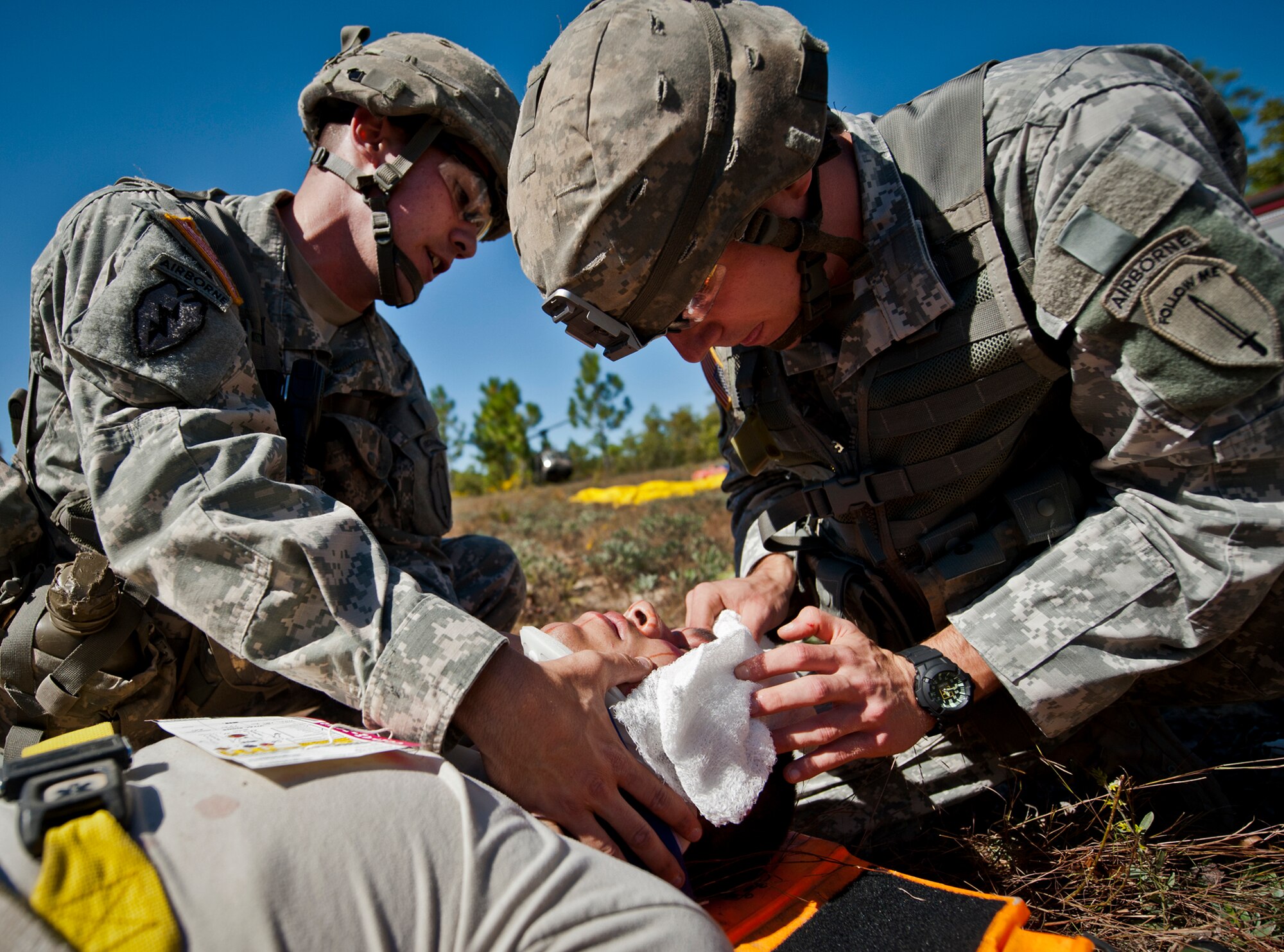 Army medics treat a victim of a simulated helicopter crash during an exercise on the Eglin range, Oct. 20.  The 6th Ranger Training Battalion, Team Eglin’s emergency responders and local medical facilities participated in the exercise that simulated a downed aircraft with 12 Soldiers injured deep within the Eglin range.  The victims were either evacuated by helicopter or by ambulance to area hospitals.  The annual exercise was to validate the battalion’s emergency procedures and test their communication with Team Eglin and local emergency and medical units.  (U.S. Air Force photo/Samuel King Jr.)