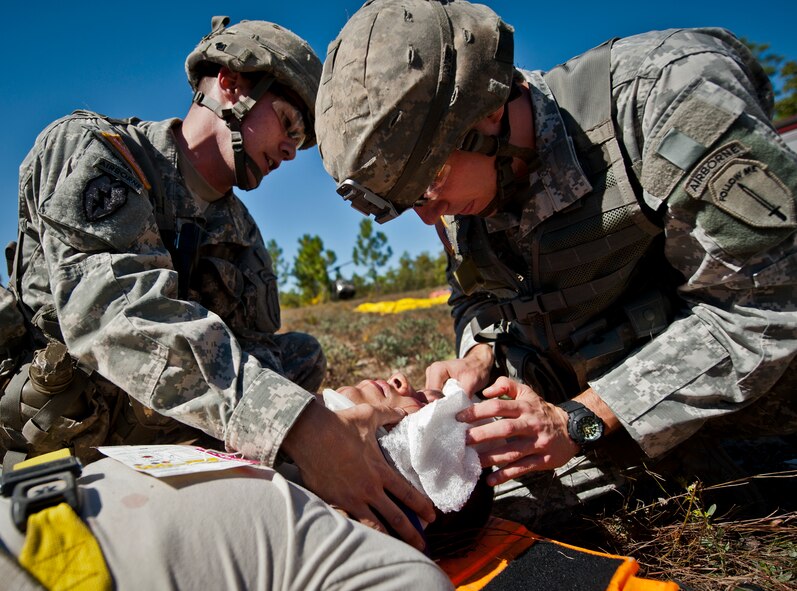 Army medics treat a victim of a simulated helicopter crash during an exercise on the Eglin range, Oct. 20.  The 6th Ranger Training Battalion, Team Eglin’s emergency responders and local medical facilities participated in the exercise that simulated a downed aircraft with 12 Soldiers injured deep within the Eglin range.  The victims were either evacuated by helicopter or by ambulance to area hospitals.  The annual exercise was to validate the battalion’s emergency procedures and test their communication with Team Eglin and local emergency and medical units.  (U.S. Air Force photo/Samuel King Jr.)