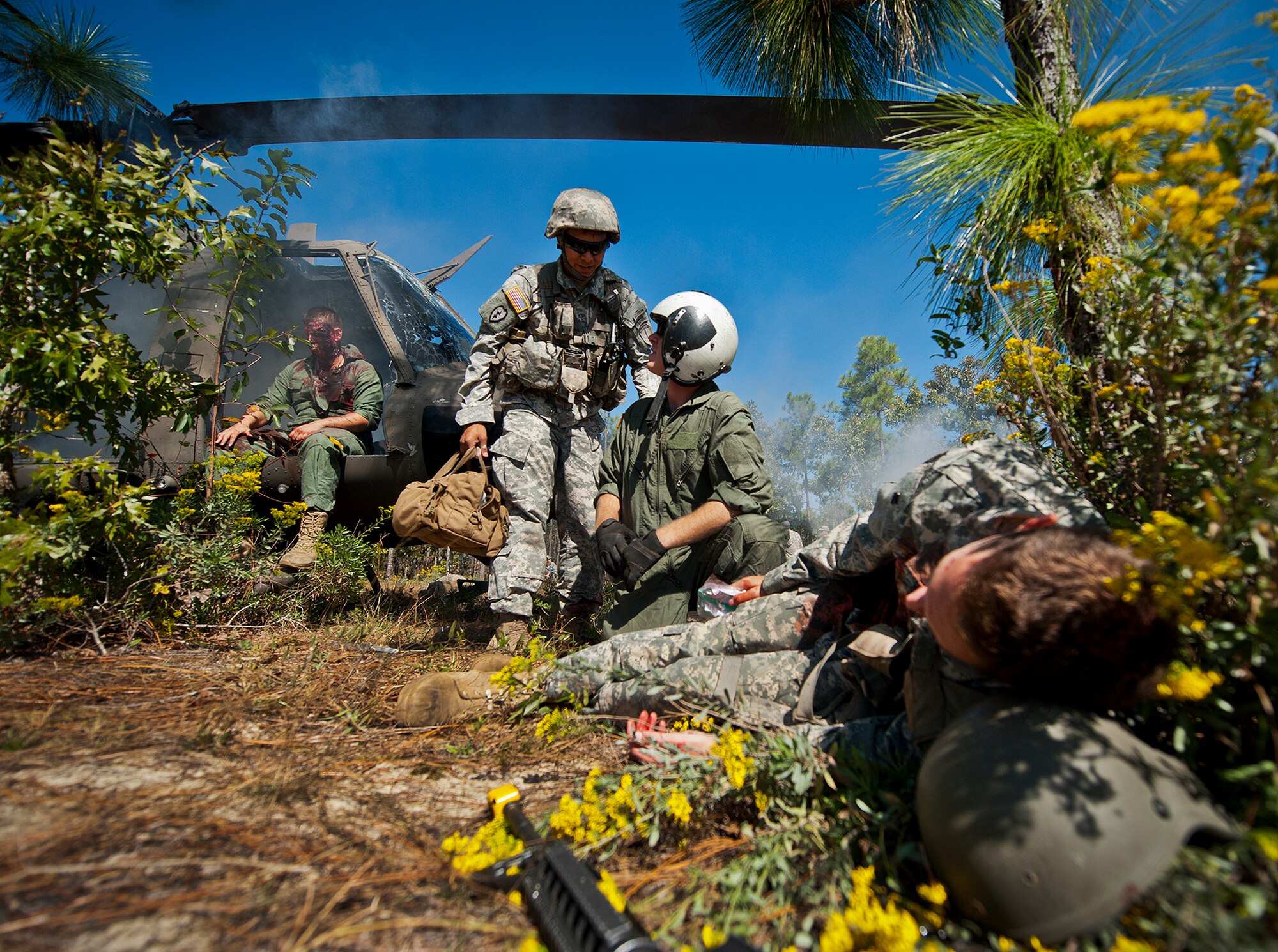 Sgt. 1st Class Brian Thomas and Spc. Ben Richardson, of the 6th Ranger Training Battalion, talk over their plan of action to help the victims of a simulated helicopter crash during an exercise on the Eglin range, Oct. 20.  The 6 RTB, Team Eglin’s emergency responders and local medical facilities participated in the exercise that simulated a downed aircraft with 12 Soldiers injured deep within the Eglin range.  The victims were either evacuated by helicopter or by ambulance to area hospitals.  The annual exercise was to validate the battalion’s emergency procedures and test their communication with Team Eglin and local emergency and medical units.  (U.S. Air Force photo/Samuel King Jr.)