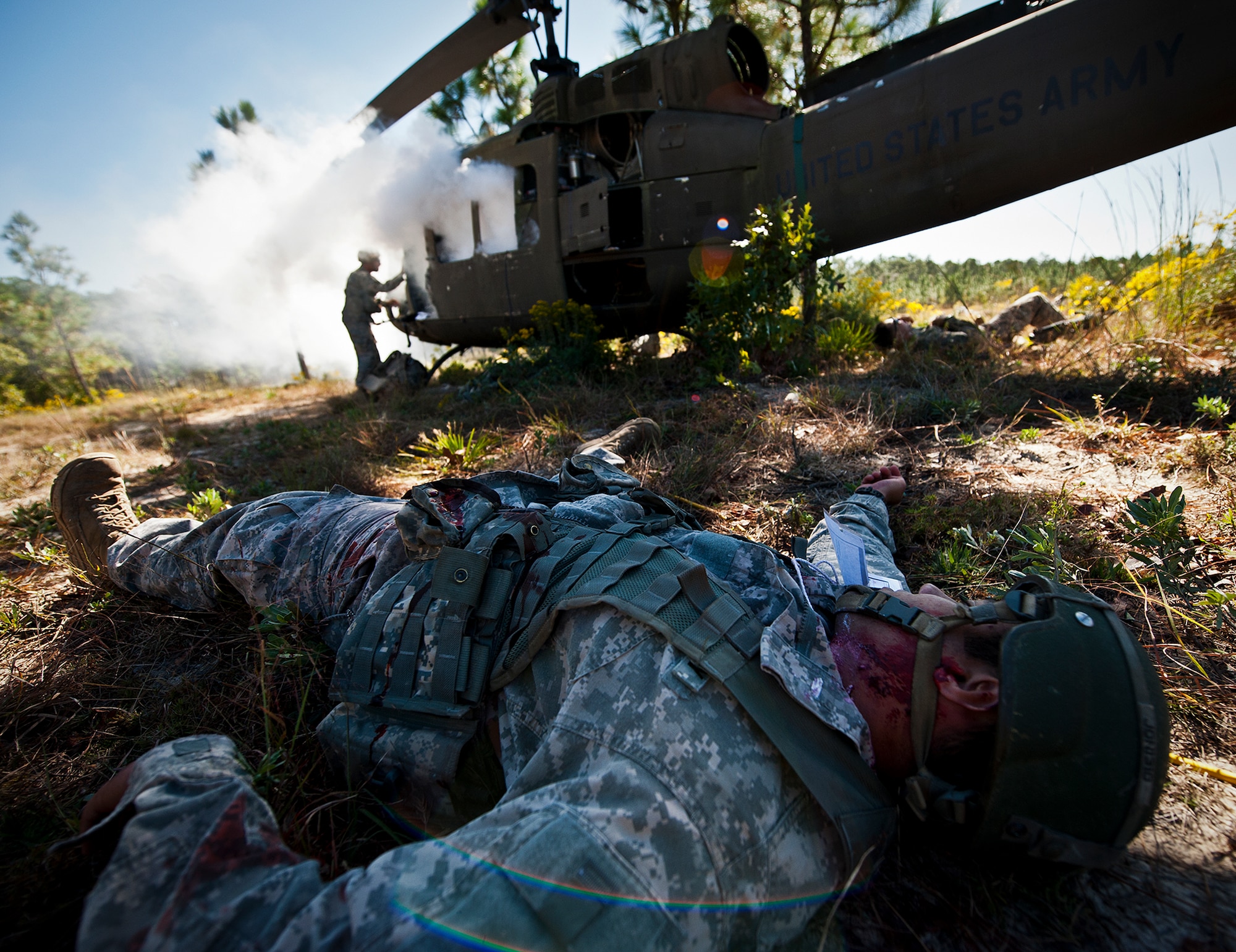 Sgt. 1st Class Brian Thomas, of the 6th Ranger Training Battalion, checks on the pilot of a simulated downed aircraft as victims lie around the crash site during an exercise on the Eglin range, Oct. 20.  The 6 RTB, Team Eglin’s emergency responders and local medical facilities participated in the exercise that simulated a downed aircraft with 12 Soldiers injured deep within the Eglin range.  The victims were either evacuated by helicopter or by ambulance to area hospitals.  The annual exercise was to validate the battalion’s emergency procedures and test their communication with Team Eglin and local emergency and medical units.  (U.S. Air Force photo/Samuel King Jr.)