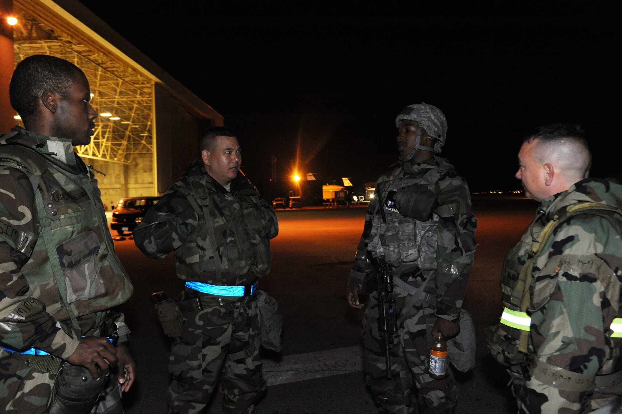 A Kadena's chapel team talks with Airman 1st Class Darius Preston, 18th Security Forces Squadron response force member, during Exercise Beverly Bearcat 12-1 on Kadena Air Base, Japan, Oct. 25, 2012. Chaplains play a critical role in ensuring the spiritual well-being of Kadena's Airmen and stand shoulder-to-shoulder with them every day, providing spiritual direction and guidance even as Airmen deploy into contingency environments. (U.S. Air Force photo/Airman 1st Class Malia Jenkins)    