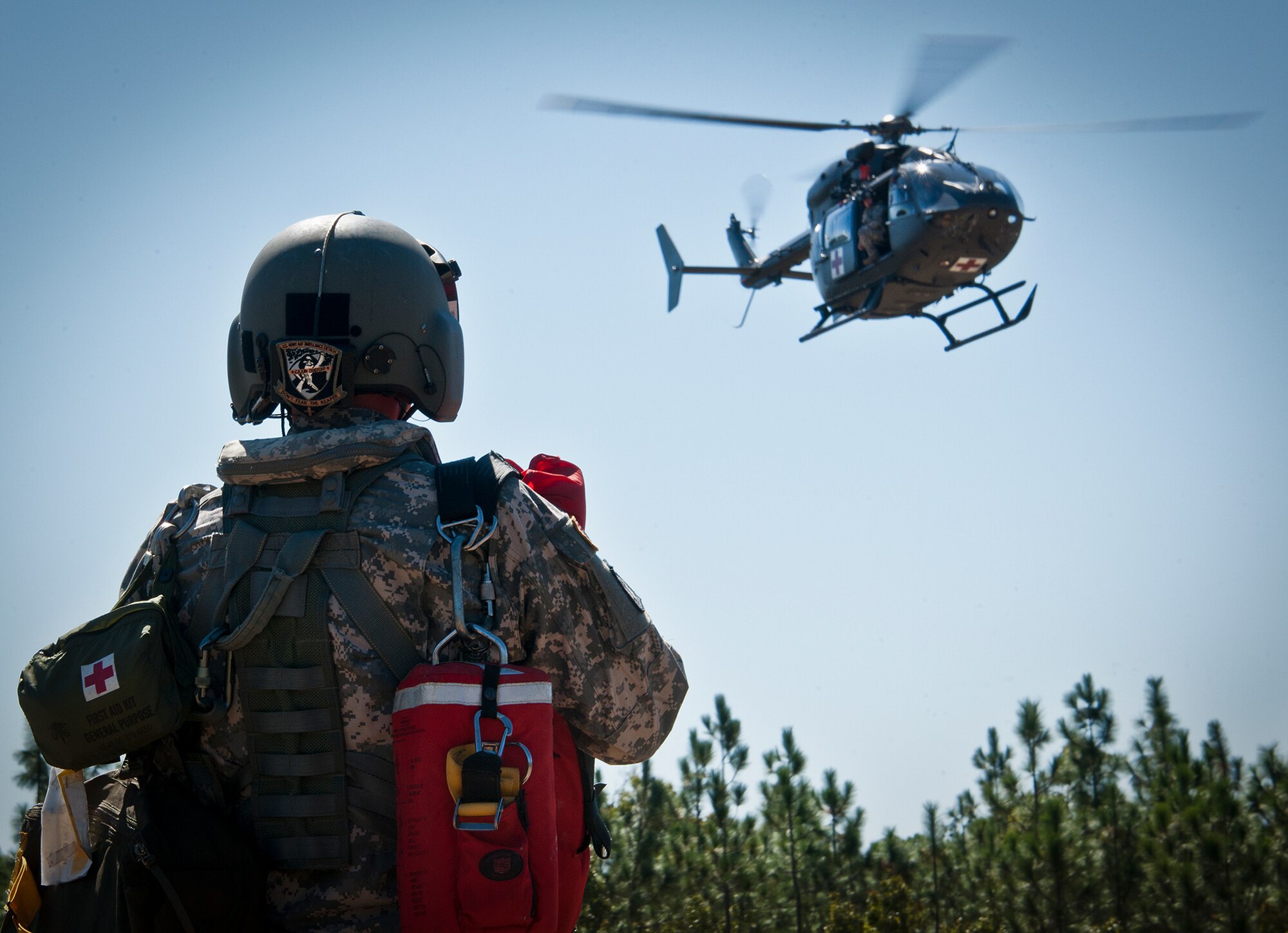 Sgt. Joe Archer watches as the LUA-72 helicopter to arrive for the next medical evacuation during a downed aircraft exercise on the Eglin range, Oct. 20.  The 6th Ranger Training Battalion, Team Eglin’s emergency responders and local medical facilities participated in the exercise that simulated a helicopter crash with 12 Soldiers injured deep within the Eglin range.  The victims were either evacuated by helicopter or by ambulance to area hospitals.  The annual exercise was to validate the battalion’s emergency procedures and test their communication with Team Eglin and local emergency and medical units.  (U.S. Air Force photo/Samuel King Jr.)