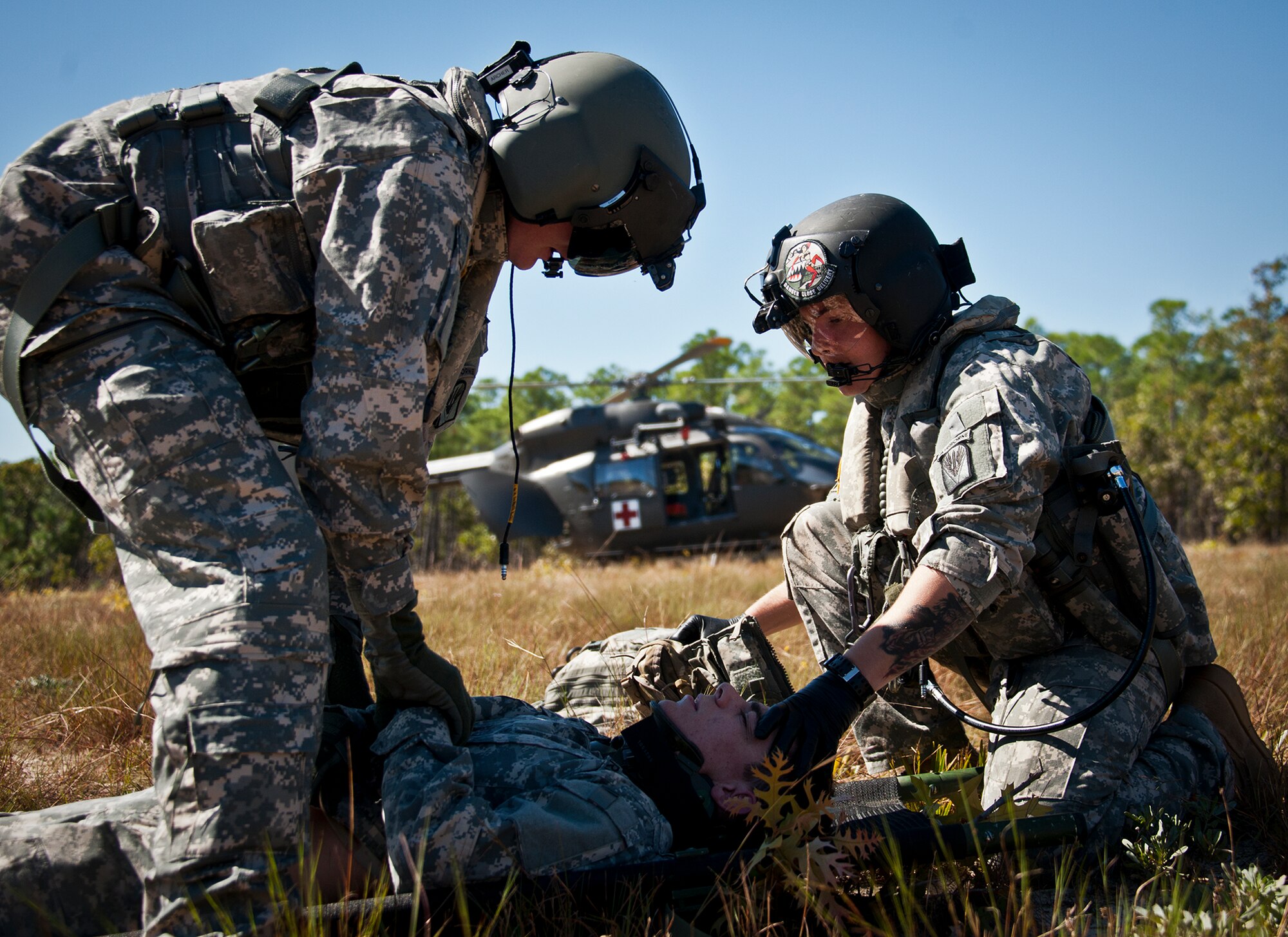 Army medics prepare a simulated victim for a helicopter evacuation during a downed aircraft exercise on the Eglin range, Oct. 20.  The 6th Ranger Training Battalion, Team Eglin’s emergency responders and local medical facilities participated in the exercise that simulated a helicopter crash with 12 Soldiers injured deep within the Eglin range.  The victims were either evacuated by helicopter or by ambulance to area hospitals.  The annual exercise was to validate the battalion’s emergency procedures and test their communication with Team Eglin and local emergency and medical units.   (U.S. Air Force photo/Samuel King Jr.)
