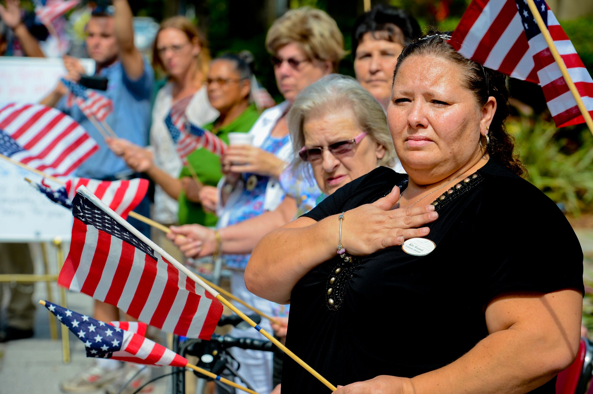 Kimberly Wozunk, Brookdale Senior Living director of life enrichment, pays her respects as the funeral procession for Spc. Brittany B. Gordon passes on Bayshore Boulevard in Tampa, Fla., Oct. 24, 2012. Gordon, a native of St. Petersburg Fla., died while supporting Operation Enduring Freedom in Kandahar, Afghanistan of wounds suffered when enemy forces attacked her unit with an improvised explosive device. (U.S. Air Force photo by Airman 1st Class David Tracy) 