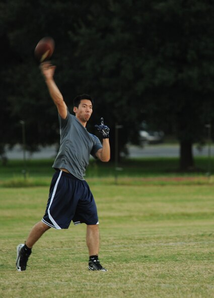 Special Agent Derek Han, Air Force Office of Special Investigations Detachment 219, throws a football during a practice session on Barksdale Air Force Base, La., Oct. 23. The Barksdale Fitness Center is hosting a flag football league where Barksdale Airmen team up and compete against each other. (U.S. Air Force Photo/Airman 1st Class Benjamin Gonsier)(RELEASED)  
