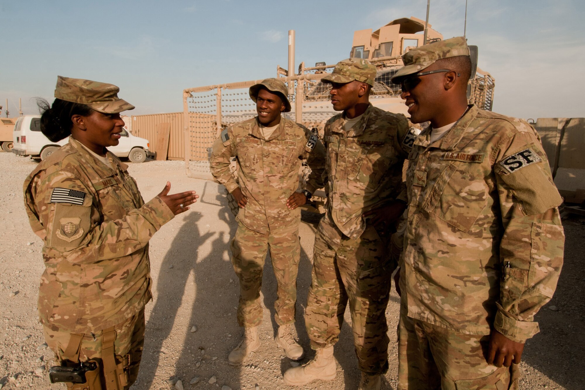 Tech. Sgt. MaryJane Mars (left), a chaplain’s assistant assigned to the 455th Air Expeditionary Wing Head Chaplain, gives spiritual advice to security forces Airmen at Bagram Airfield, Afghanistan, Oct. 24, 2012. Mars provides crisis intervention counseling to members of the 455th Expeditionary Security Forces Squadron. Additionally, she supports the Bagram Office of Special Investigations. (U.S. Air Force photo/Staff Sgt. Jeff Nevison)
