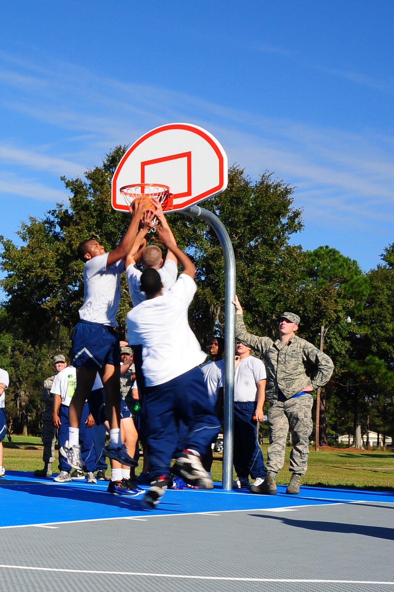 Airmen compete in the basketball championship game during the Dorm Challenge Oct. 19, 2012, at Joint Base Charleston - Air Base, S.C. Dorm 473 won first place, Dorm 466 finished in second place and Dorm 461 and 464 tied for third place. Dorm 473 won the trophy for receiving the most points in all the competition’s categories: education, volunteerism, dorm inspection and fitness. (U.S. Air Force photo/ Airman 1st Class Chacarra Walker)