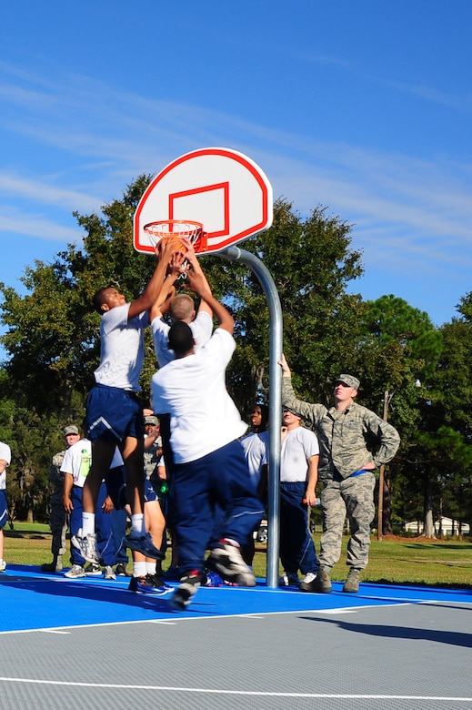 Airmen compete in the basketball championship game during the Dorm Challenge Oct. 19, 2012, at Joint Base Charleston - Air Base, S.C. Dorm 473 won first place, Dorm 466 finished in second place and Dorm 461 and 464 tied for third place. Dorm 473 won the trophy for receiving the most points in all the competition’s categories: education, volunteerism, dorm inspection and fitness. (U.S. Air Force photo/ Airman 1st Class Chacarra Walker)