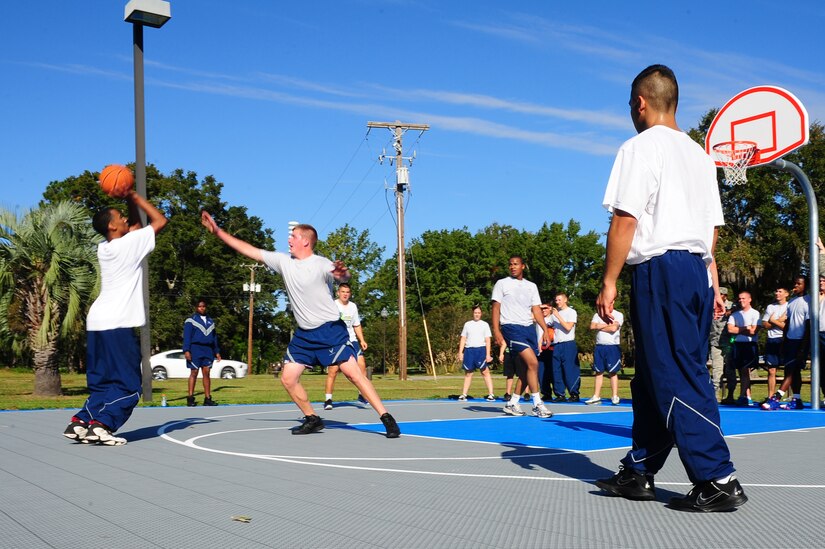 Airmen compete in the basketball championship game during the Dorm Challenge Oct. 19, 2012, at Joint Base Charleston - Air Base, S.C. Dorm 473 won first place, Dorm 466 finished in second place and Dorm 461 and 464 tied for third place. Dorm 473 won the competition by receiving the most points in all the competition’s categories: education, volunteerism, dorm inspection and fitness. (U.S. Air Force photo/ Airman 1st Class Chacarra Walker)