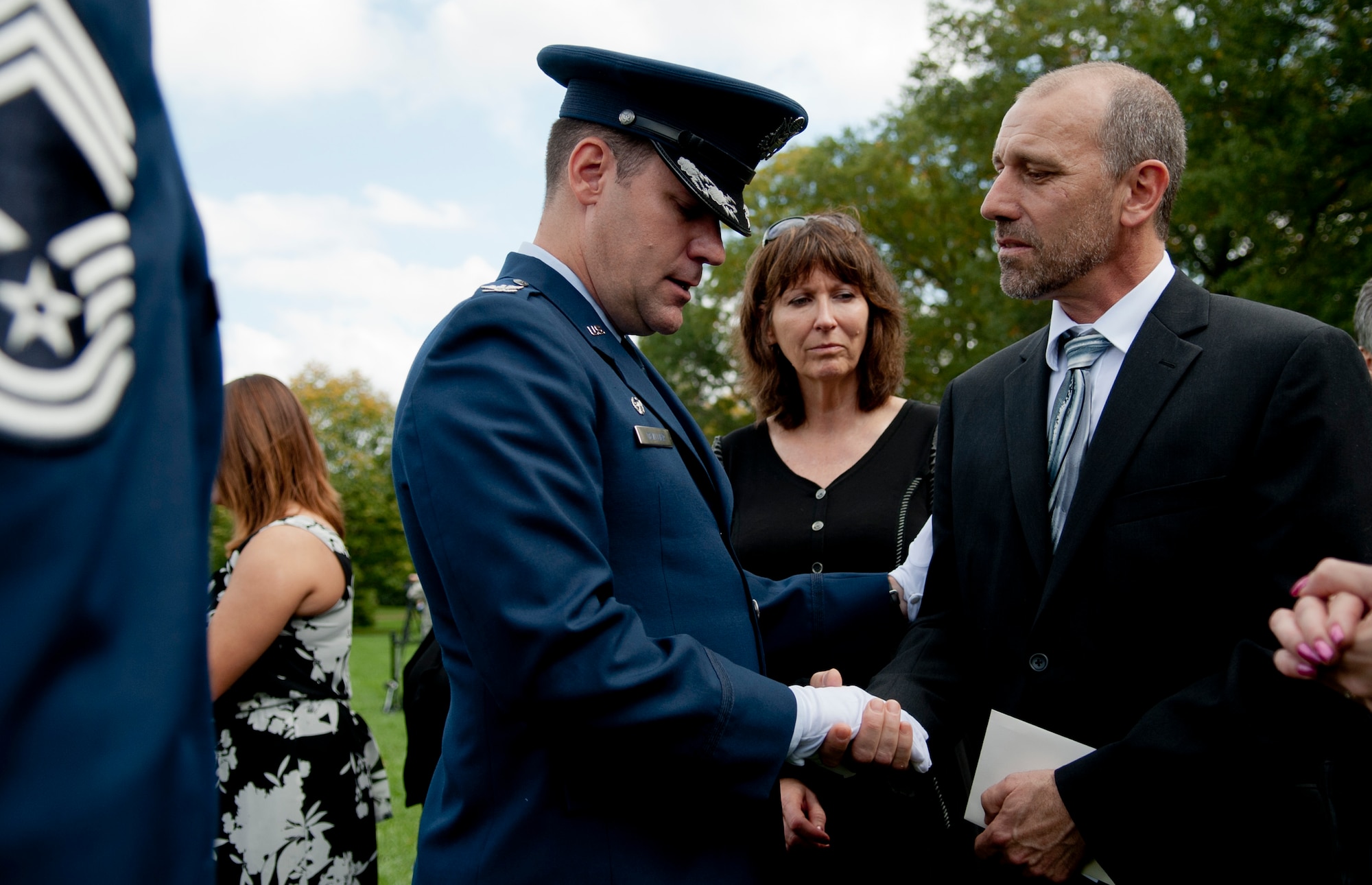 Col. John Devillier, Air Force Mortuary Affairs, Commander, provides his condolences to Mr. Greg Mille, son to Col. Wendell Keller, after Mr. Miller's father's official funeral at the Arlington National Cemetery Oct. 20, 2012. March 1, 1969, Col. Wendell Keller and Capt. Virgil Meroney were the crew of an F-4D Phantom II aircraft that went down while carrying out a night time strike mission in Khammouan Province, Laos. Nearby aircrews reported seeing the aircraft hit by enemy fire. No parachutes were seen after the aircraft was hit. Heavy enemy presence in the area prevented recovery efforts. Between 1994 to 2011, the  (U.S. Air Force photo/Master Sgt. Cecilio Ricardo)












