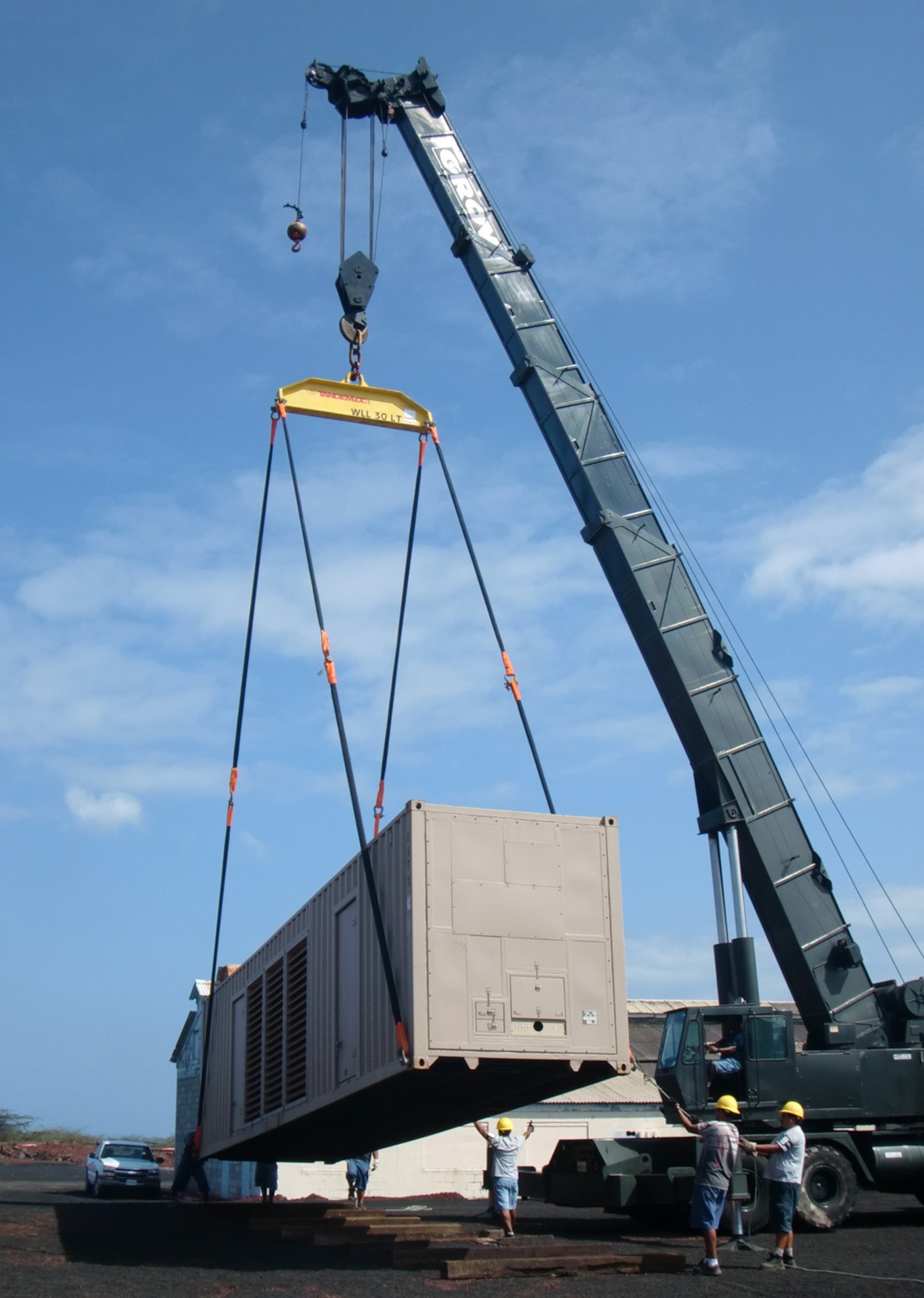 ASCENSION AUXILIARY AIR BASE, Ascension Island -- Contractors here help move one of two 1.6MW generators into place. The Civil Engineer Maintenance Inspection and Repair Team Emergency Power Systems will serve as vital power back up and relief to the airfield’s main power generators and give this remote base the ability to perform necessary maintenance on their existing electrical equipment. (U.S. Air Force photo)