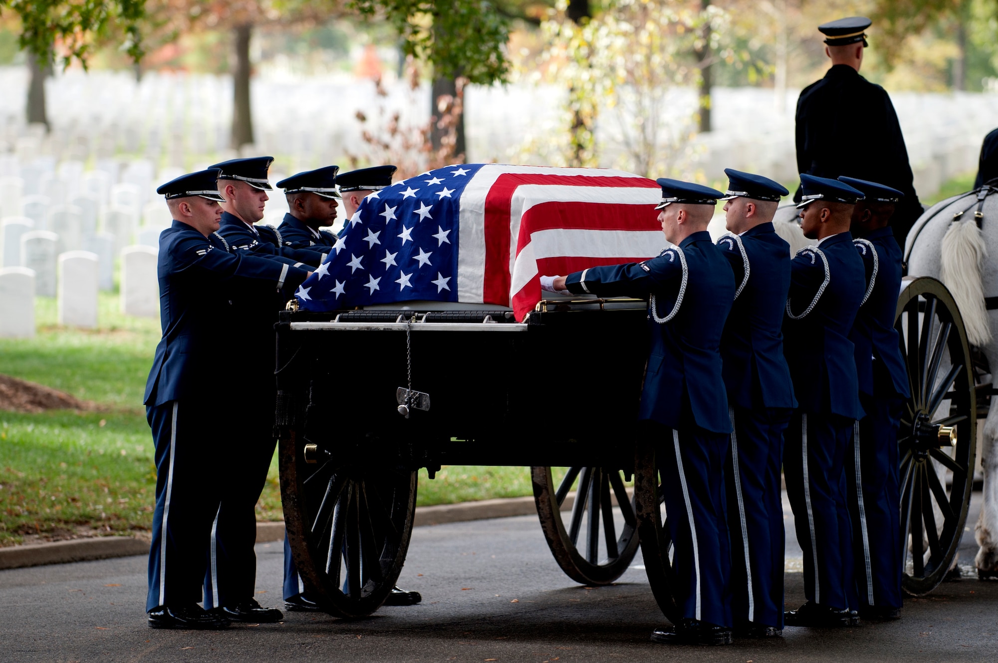 The U.S.Air Force Honor Guard's Body Bearers team prepares to remove the remains of Col. Wendell Keller, of Fargo, N.D., and Capt.Virgil K. Meroney, of Fayetteville, Ark., from the caisson and carry them to their final resting place at the Arlington National Cemetery Oct. 20, 2012. March 1, 1969, Keller and Meroney were the crew of an F-4D Phantom II aircraft that went down while carrying out a night time strike mission in Khammouan Province, Laos. Nearby aircrews reported seeing the aircraft hit by enemy fire. No parachutes were seen after the aircraft was hit. Heavy enemy presence in the area prevented recovery efforts. Between 1994 to 2011, the  (U.S. Air Force photo/Master Sgt. Cecilio Ricardo)





