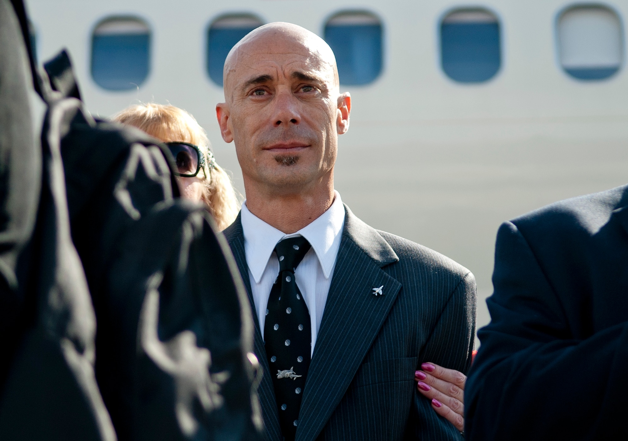Michael Keller watches as the remains of his father, Col. Wendell Keller, of Fargo N.D. and Capt.Virgil K. Meroney, of Fayetteville, Ark., are carried in a casket draped with the U.S. Flag by the U.S. Air Force Honor Guard team to a hearse at Ronald Reagan Washington National Airport Oct. 18, 2012.  March 1, 1969, Keller and Meroney were the crew of an F-4D Phantom II aircraft that went down while carrying out a night time strike mission in Khammouan Province, Laos. Nearby aircrews reported seeing the aircraft hit by enemy fire. No parachutes were seen after the aircraft was hit. Heavy enemy presence in the area prevented recovery efforts.  (U.S. Air Force photo/Master Sgt. Cecilio Ricardo)


