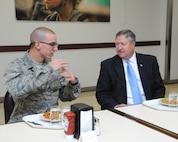The Honorable Michael B. Donley, Secretary of the Air Force, talks to Trainee Spencer Marks, 326th Training Squadron, during lunch at Joint Base San Antonio-Lackland Oct. 23. Marks is in his 8th week of training and will graduate Nov. 2.  (U.S. Air Force photo by Rich McFadden)