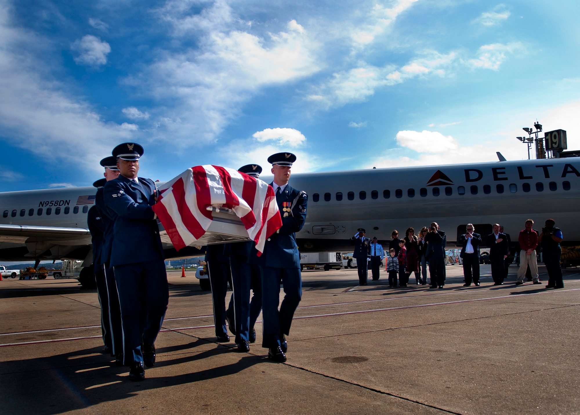U.S. Air Force Honor Guard members carry the remains of Col. Wendell Keller, of Fargo N.D. and Capt.Virgil K. Meroney, of Fayetteville, Ark., at Ronald Reagan Washington National Airport Oct. 18, 2012. Family members were present at the arrival. March 1, 1969, Keller and Meroney were the crew of an F-4D Phantom II aircraft that went down while carrying out a night time strike mission in Khammouan Province, Laos. Nearby aircrews reported seeing the aircraft hit by enemy fire. No parachutes were seen after the aircraft was hit. Heavy enemy presence in the area prevented recovery efforts.   (U.S. Air Force photo/Master Sgt. Cecilio Ricardo)