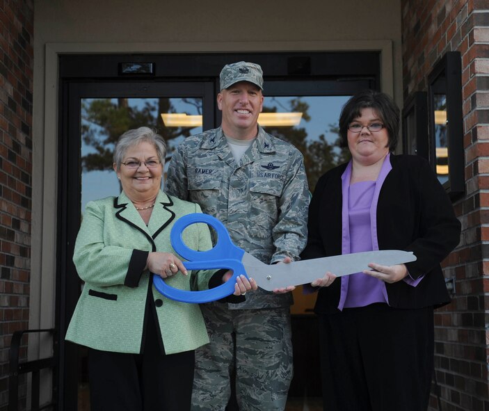 U.S. Air Force Col. Steven Ramer, 23d Wing vice commander, Gayle Major, housing asset manager, and Dee Hathcock, Moody family housing community director, pose outside the Housing Welcome Center at Moody Air Force Base, Ga., Oct. 24, 2012. The ceremony recognized the completion of the renovated housing center. (U.S. Air Force photo by Airman 1st Class Olivia Bumpers/Released)