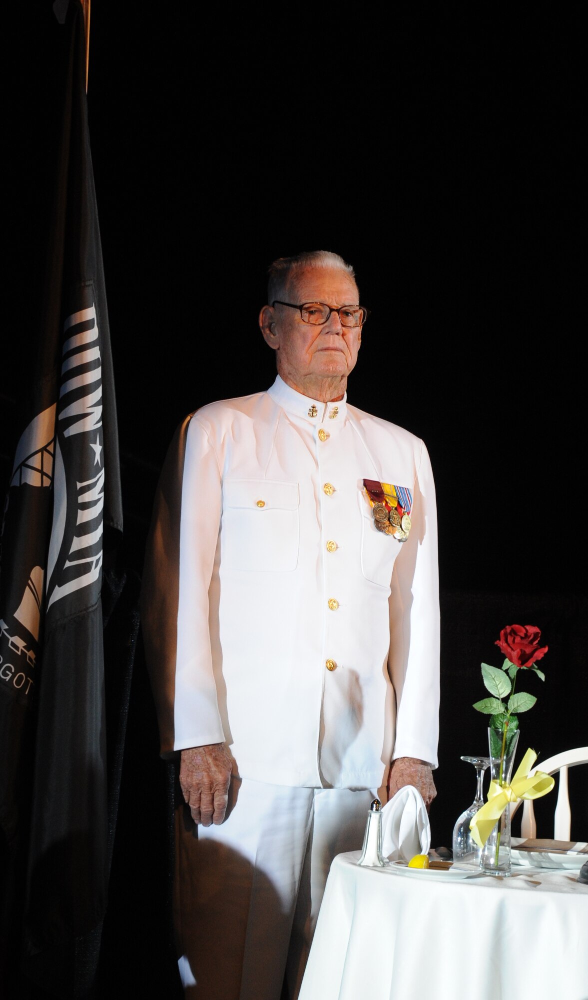 Hugh Wingo, retired Navy Chief, of Asheville, N.C., stands at attention during a POW/MIA tribute at the 34th Annual Salute To The Military Oct. 23, 2012, at the Mississippi Coast Coliseum in Biloxi.  Wingo was stationed at Pearl Harbor during World War II and assigned to the destroyer USS Benham (DD 397) during the Battle of Midway.  (U.S. Air Force photo by Kemberly Groue)