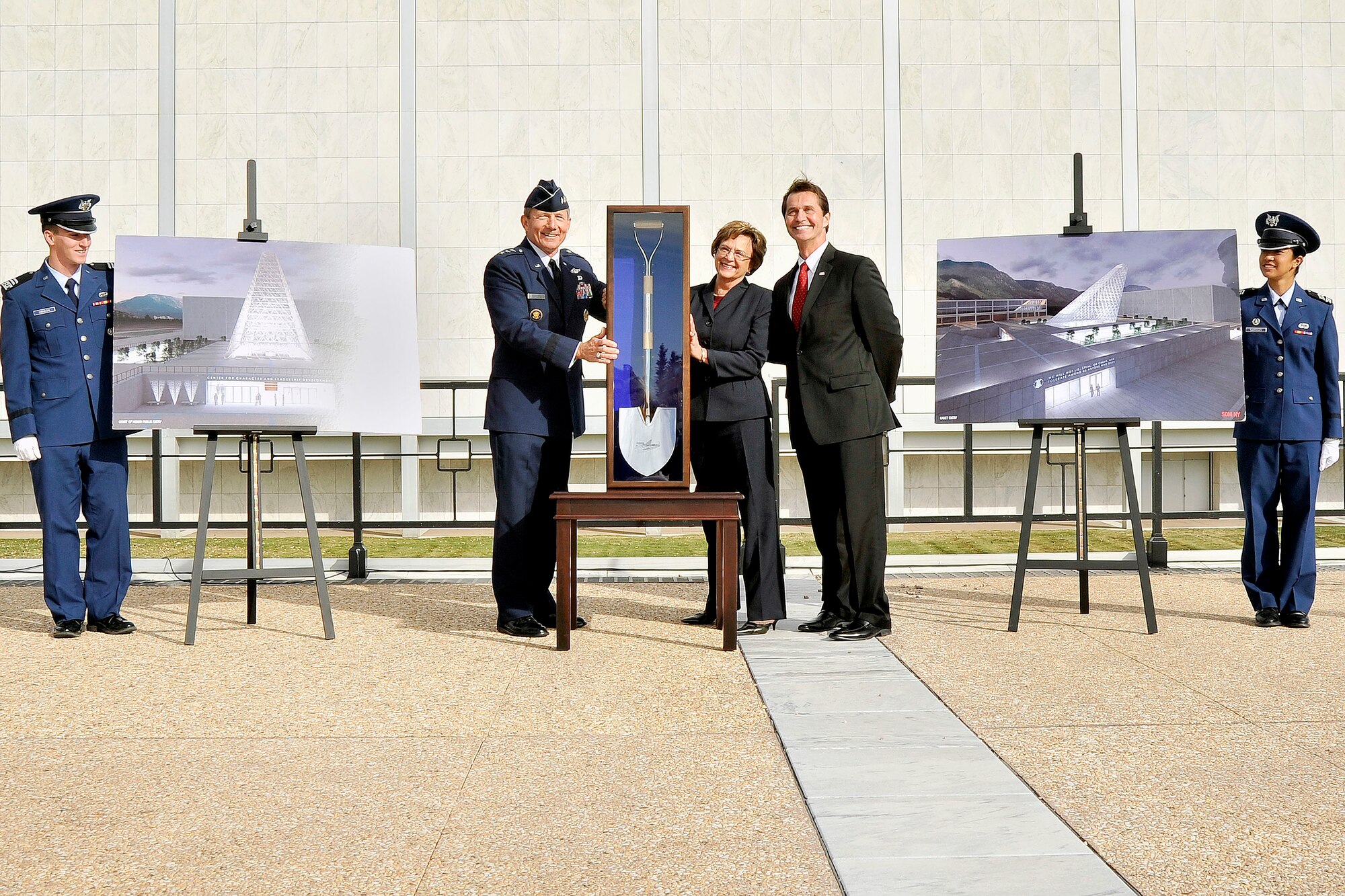 Air Force Academy Superintendent Lt. Gen. Mike Gould (second from left) unveils one of the ceremonial shovels that will be used for groundbreaking of the Air Force Academy's Center for Character and Leadership Development facility. The new facility, scheduled to be finished in 2014, was made possible through $30 million in annual military construction budget funds and $10 million in private donations. (U.S. Air Force photo/Liz Copan)