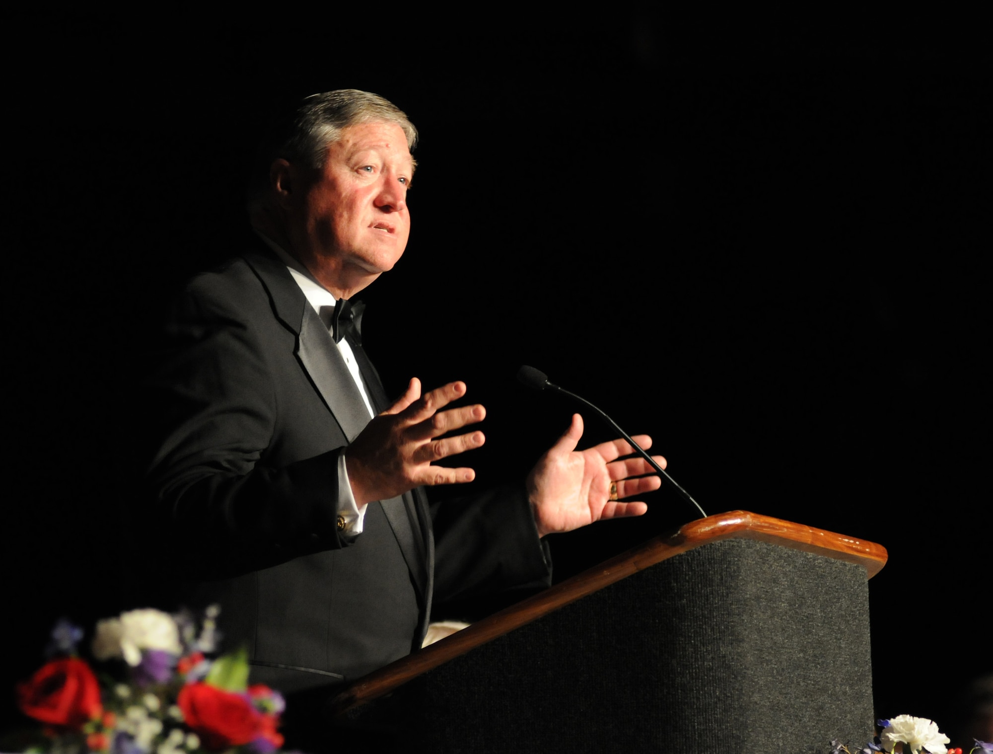 Secretary of the Air Force Michael Donley, delivered remarks during the 34th Annual Salute To The Military Oct. 23, 2012, at the Mississippi Coast Coliseum in Biloxi, Miss.  Master Sgt. Nicole Dismute, Mathies NCO Academy, Keesler Air Force Base, was recognized as the winner of the Thomas V. Fredian Community Leadership Award at the event.  (U.S. Air Force photo by Kemberly Groue)