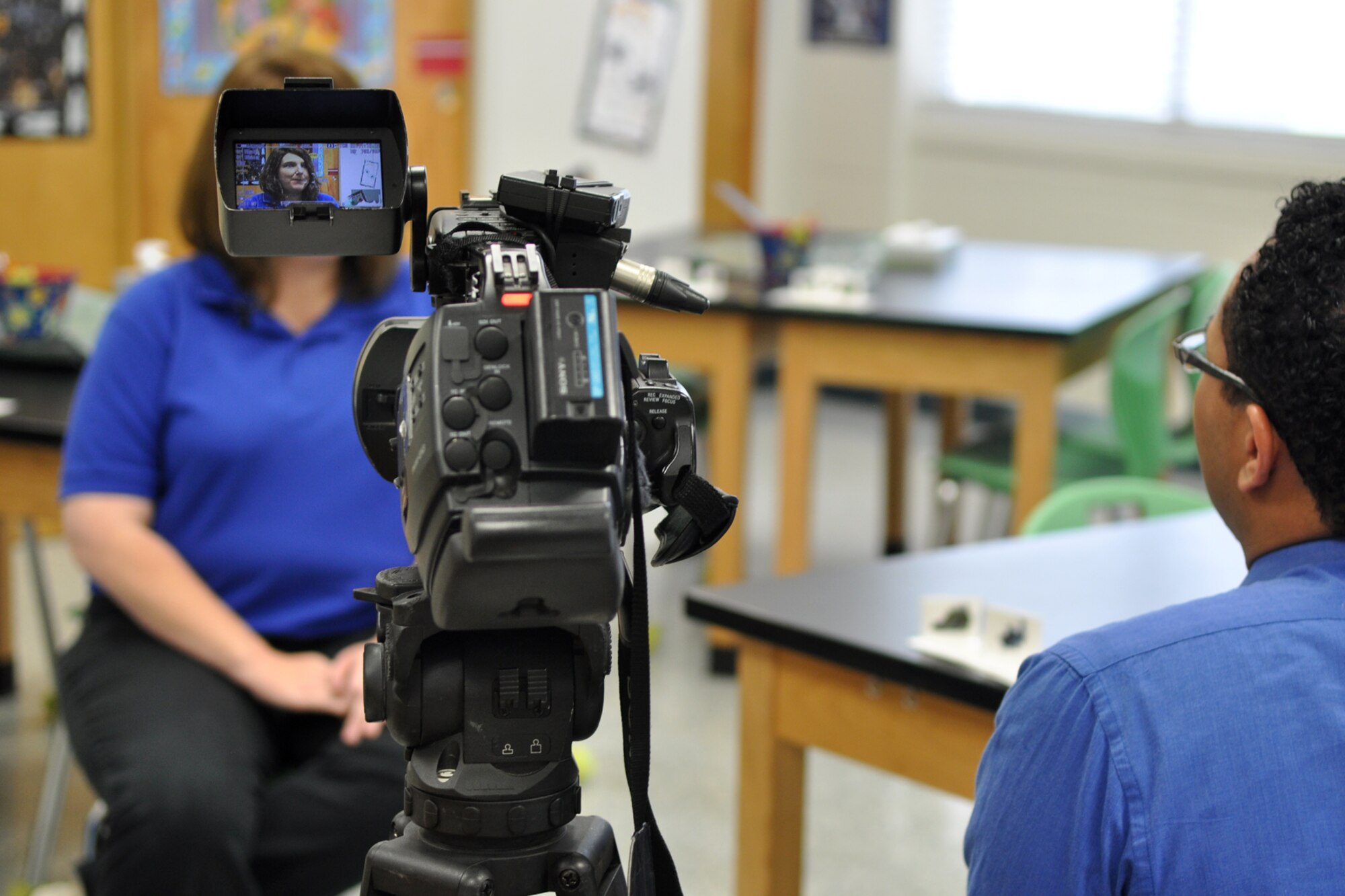 Eric James, multimedia journalist, KTBS Channel 3, interviews Christy Bucker, technology coordinator/instructor, STARBASE Louisiana, at Barksdale Air Force Base, La., Oct. 23, 2012. James was working on a journalistic series about the Claiborne Fundamental Elementary School being selected as a 2012 National Blue Ribbon School by the Department of Education. The Department will honor approximately 219 public and 50 private schools at a recognition ceremony on Nov. 12-13 in Washington, D.C. The Claiborne students are attending STARBASE Louisiana, at Barksdale, one of 60 national STARBASE sites. It is sponsored by the 307th BW of the Air Force Reserve Command. The STARBASE program presents an exciting 25-hour hands on/minds on aviation and aerospace curriculum to area 5th grade students and their teachers. (U.S. Air Force photo by Master Sgt. Jeff Walston)