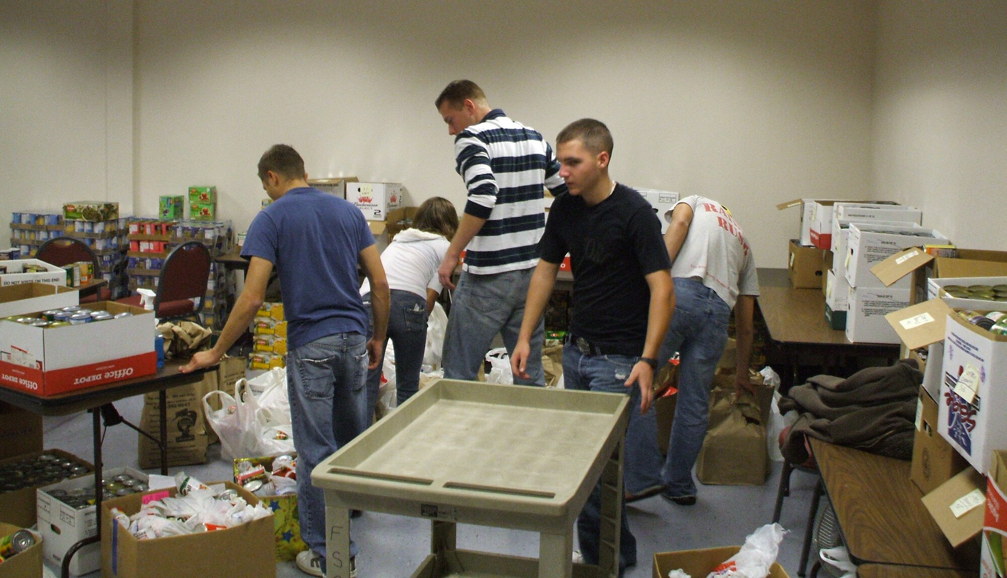Donated food is sorted through and prepared for inclusion into individual baskets at the Airman & Family Readiness Center for the Holiday Food Basket program at Sheppard Air Force Base, Texas.  The A&FRC Holiday Food Basket program is accepting donations for this year's program. (U.S. Air Force courtesy photo)