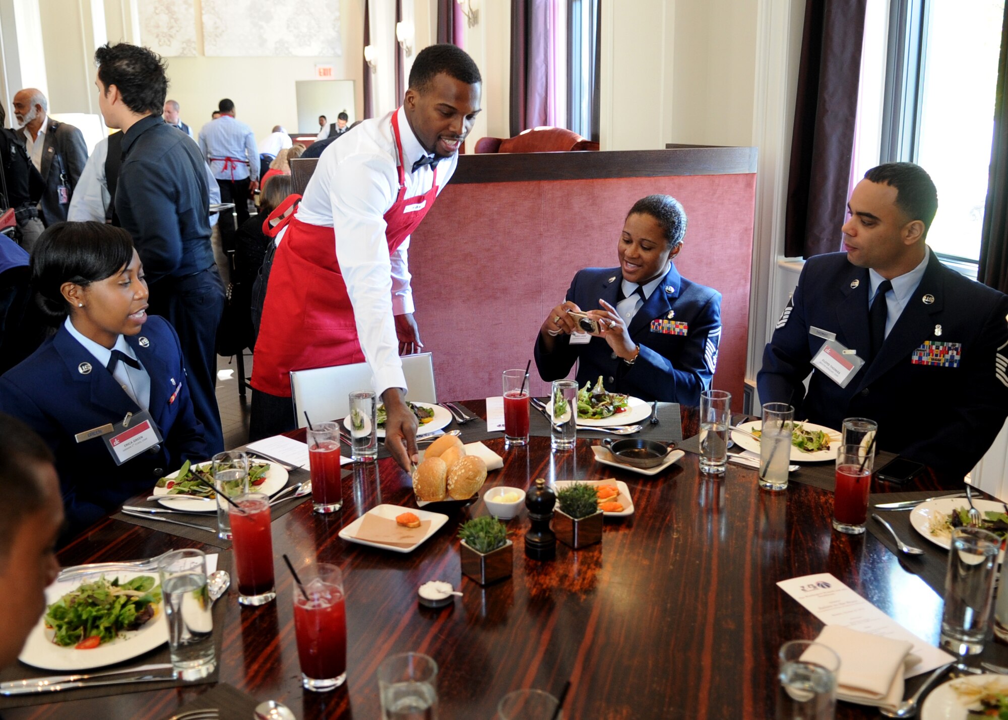 Shelvin Mack, Washington Wizards point guard, serves Airmen from the 79th Medical Wing, Joint Base Andrews, Md., during the 3rd Annual Salute to the Stars luncheon at in Washington, D.C., Oct. 22, 2012. During the luncheon the service members and their families were served a complementary four course meal. (U.S. Air Force photo/ Staff Sgt. Nichelle Anderson)
