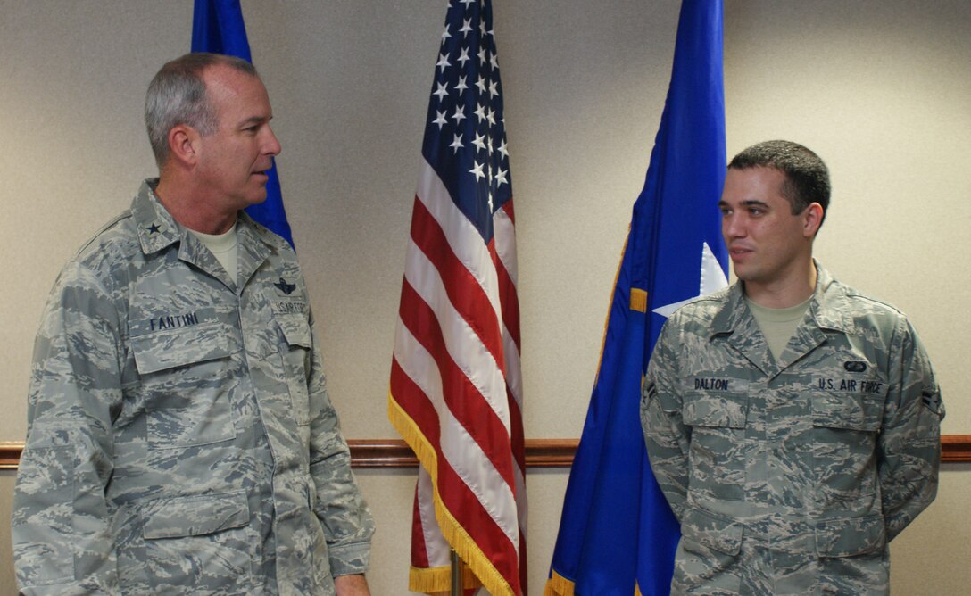 Brig. Gen. Michael Fantini (left), 82nd Training Wing commander, congratulates Airman 1st Class Andrew Dalton, 82nd Comptroller Squadron, on his selection as the "Commander's Wingman of Choice" for Oct. 22-26.  Dalton was recognized during the wing staff meeting Oct. 24. (U.S. Air Force photo/Dan Hawkins)