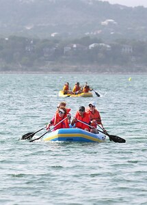 X-treme team Road Divas members, (from left to right), Kimberly Felty, Carolina Marin Solo, Johanna House and Jennifer Mitchell, row during the 2-mile rafting course as part of the Rambler 120 competition Oct. 20 at the Joint Base San Antonio Recreation Park at Canyon Lake.  





