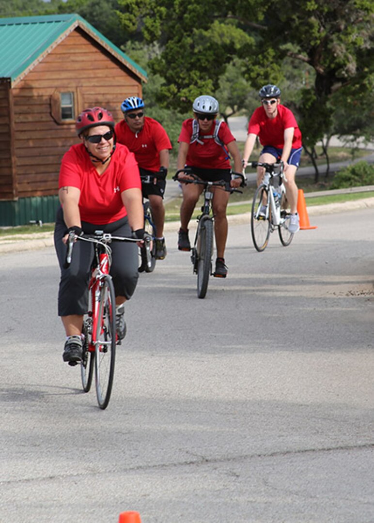 Team Kick Rx members (from left to right), Kimberly Ortmeyer, Carlos Martinez, Oriana Davila, and Justin Lusk, compete with 36 other teams in the 22-mile bike race portion of the seventh annual Rambler 120 Competition Oct 20 at Joint Base San Antonio Recreation Park at Canyon Lake.  The endurance portion event included running, cycling, rowing and a mystery event.




