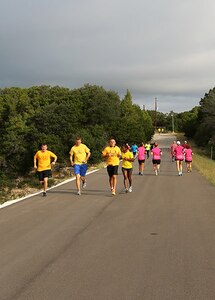 (From left to right), Peter Springirth, Shane Meling, Andrew Armstrong, and Latoya Siples, members of the 433rd Logistics Readiness Squadron Team, compete with 36 other teams during a 6-mile run Oct. 20 at the Joint Base San Antonio Recreation Park at Canyon Lake.  The annual event promotes physical fitness and morale. 


