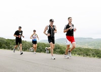 Rambler 120 competition athletes (from left to right), Dave Larrabee, Holly Richard, Tim Hanson, and Merle Richard of the Max Effort Team, compete with 36 other teams during a 6-mile run Oct. 20 at the Joint Base San Antonio Recreation Park at Canyon Lake.   Team Max Effort had the overall fastest X-treme team time at 2:21:37.  The annual event promotes physical fitness and morale. 

