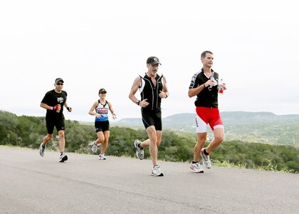 Rambler 120 competition athletes (from left to right), Dave Larrabee, Holly Richard, Tim Hanson, and Merle Richard of the Max Effort Team, compete with 36 other teams during a 6-mile run Oct. 20 at the Joint Base San Antonio Recreation Park at Canyon Lake.   Team Max Effort had the overall fastest X-treme team time at 2:21:37.  The annual event promotes physical fitness and morale. 

