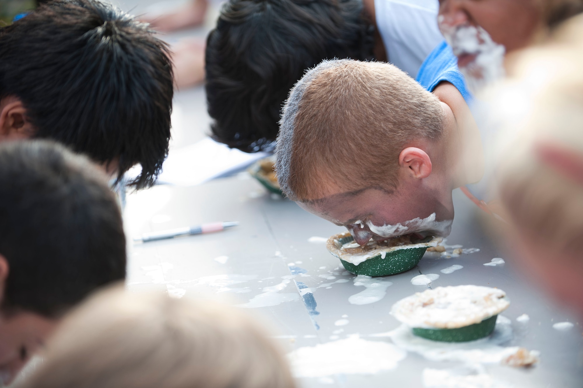 A child competes in a pie eating contest during Fall Fest Oct. 20, 2012, at Incirlik Air Base, Turkey. The contest was one of many at Fall Fest, which is held annually by the 39th Force Support Squadron. (U.S. Air Force photo by Senior Airman Clayton Lenhardt/Released)