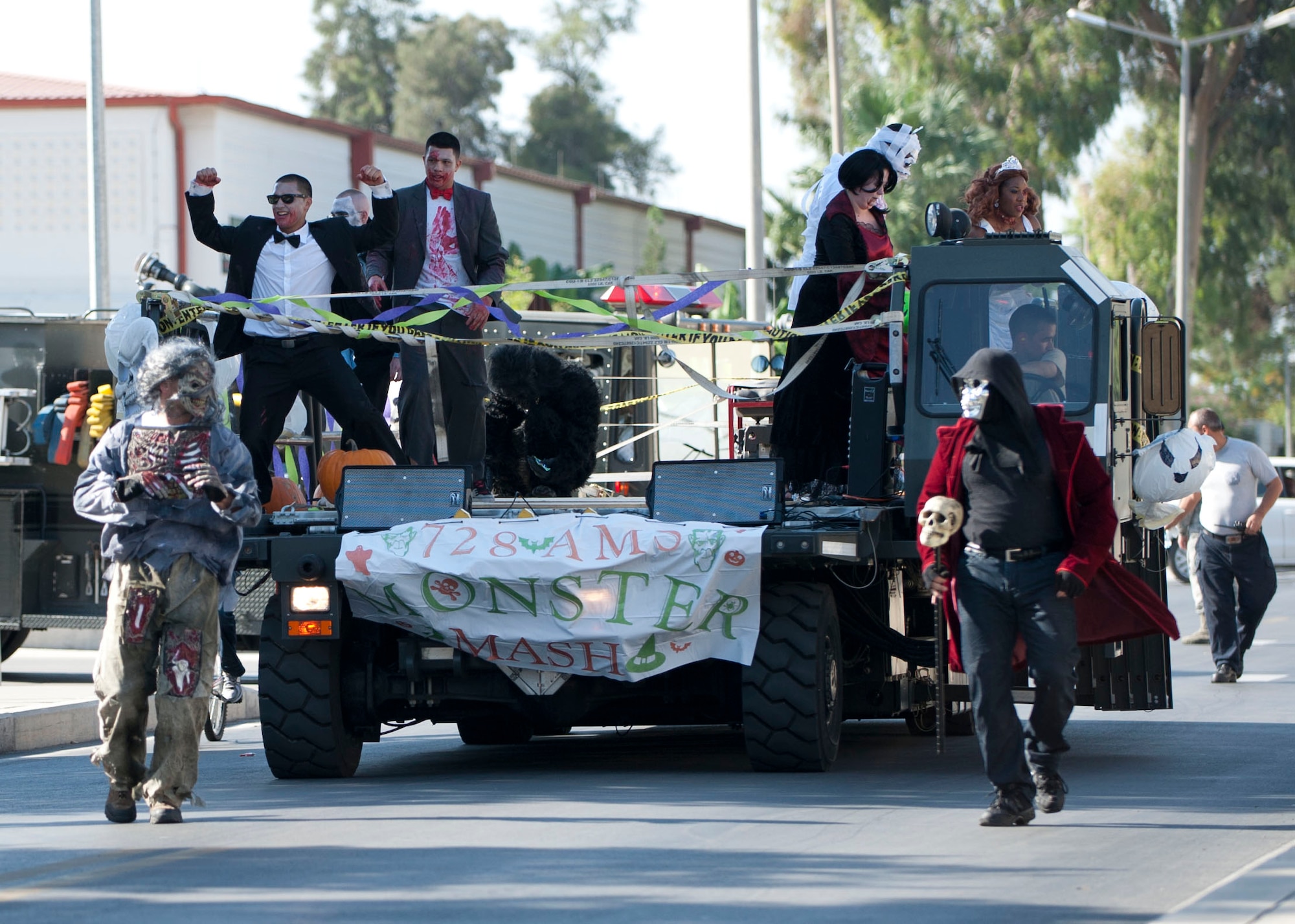 Members of the 728th Air Mobility Squadron dance during a parade to kick off Fall Fest Oct. 20, 2012, at Incirlik Air Base, Turkey. The parade route led to Arkadas Park where there were food booths, carnival games, camel and pony rides to celebrate autumn at Incirlik. (U.S. Air Force photo by Senior Airman Clayton Lenhardt/Released)