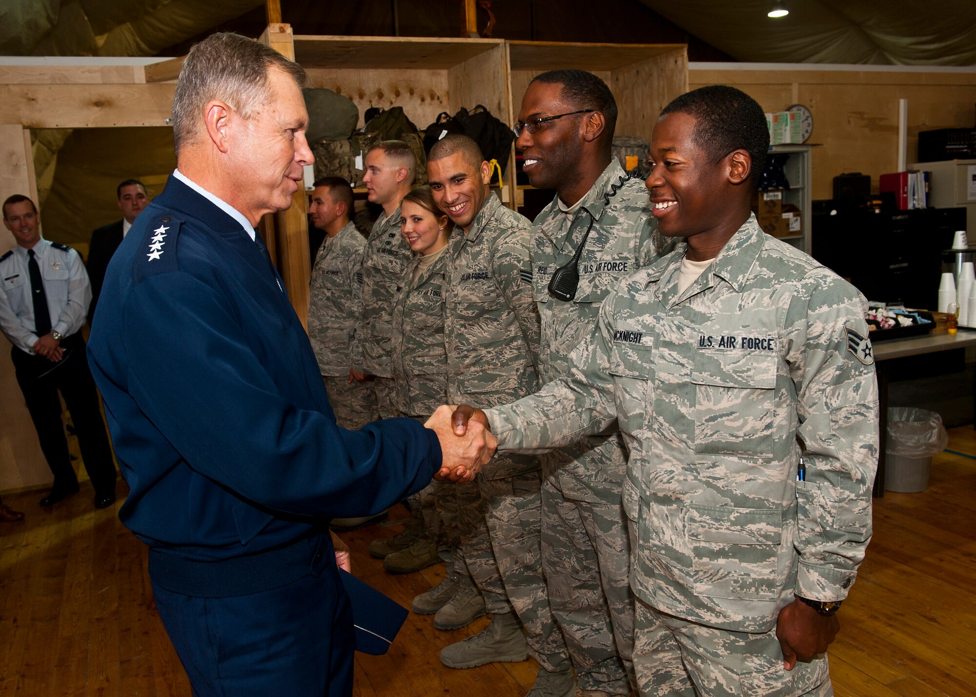 Gen. William M. Fraser III (left), U.S. Transportation Command commander, meets with Senior Airman Azim McKnight, a 376th Expeditionary Logistics Readiness Squadron aerial porter, during a tour at the Transit Center at Manas, Kyrgyzstan, Oct. 23, 2012. Fraser was on hand to visit deployed service members and learn about the Transit Center's daily operations. McKnight is deployed from Dover Air Force Base, Del., and a native of Philadelphia. (U.S. Air Force photo/Senior Airman Brett Clashman)