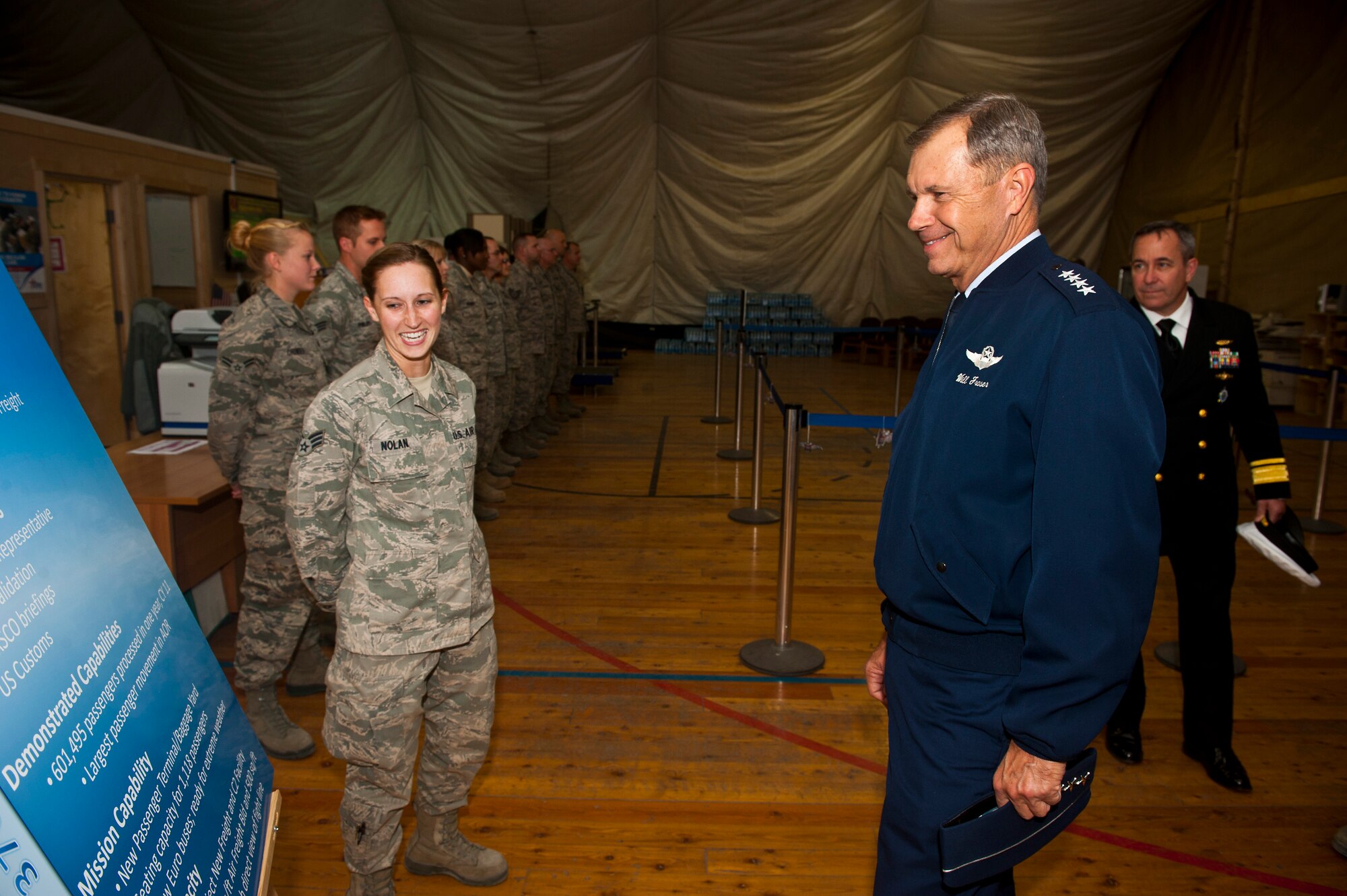 Senior Airman Ashley Nolan (left), a 376th Expeditionary Logistics Readiness Squadron aerial porter provides a mission brief about the Aerial Port flight's operations to Gen. William M. Fraser III, U.S. Transportation Command commander, at the Transit Center at Manas, Kyrgyzstan, Oct. 23, 2012. Fraser visited with deployed service members and learned day-to-day operations conducted at the Transit Center. Nolan is deployed from Dover Air Force Base, Del., and a native of Washington D.C. (U.S. Air Force photo/Senior Airman Brett Clashman)