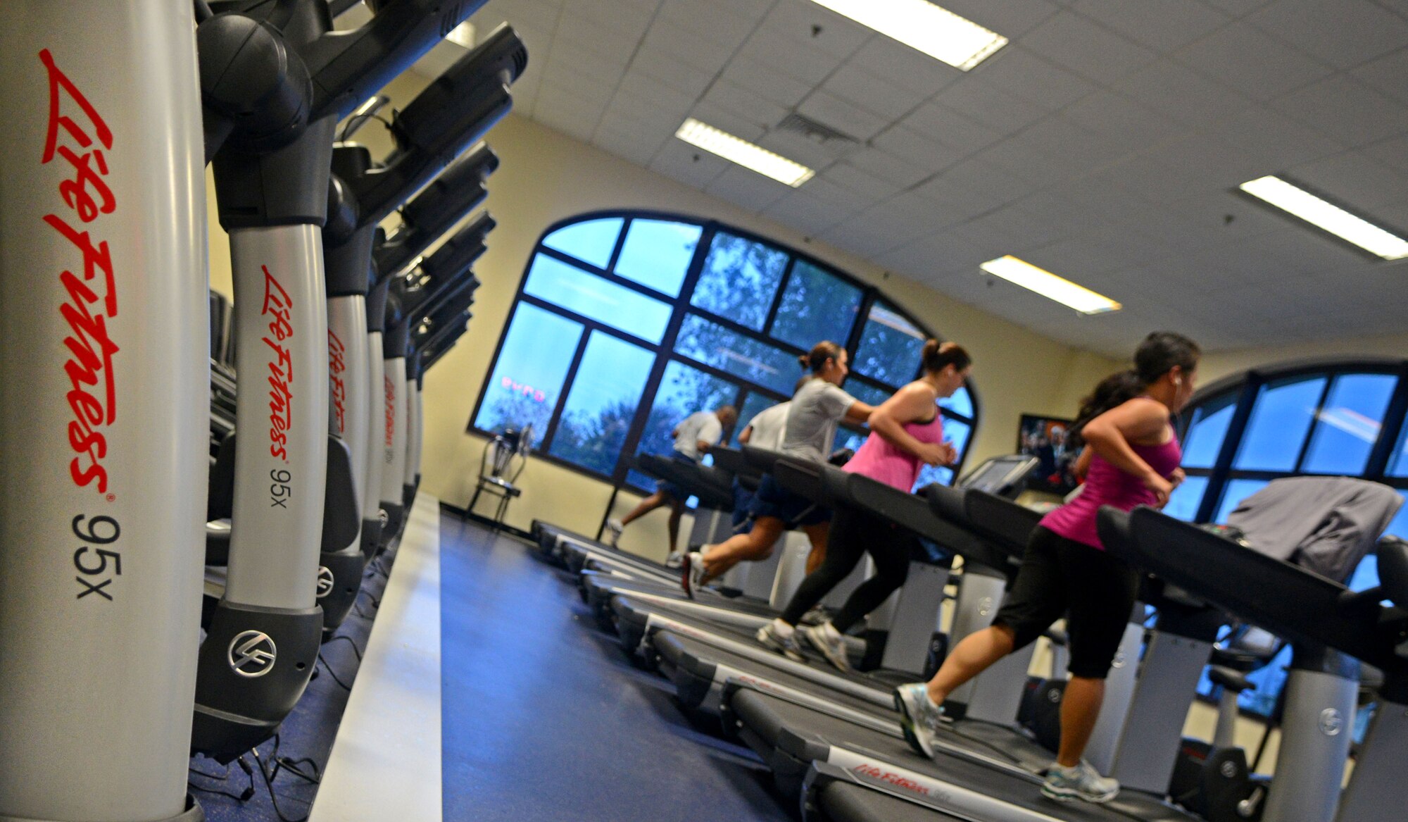 Aviano Airmen use new cardio equipment at the Dragon Fitness Center Oct. 4 at Aviano Air Base, Italy. Both the Falcon and Dragon Fitness Centers recently made significant improvements to their facilities, including new cardio equipment, televisions and DVD players. (U.S. Air Force photo/Airman 1st Class Jenay Randolph)